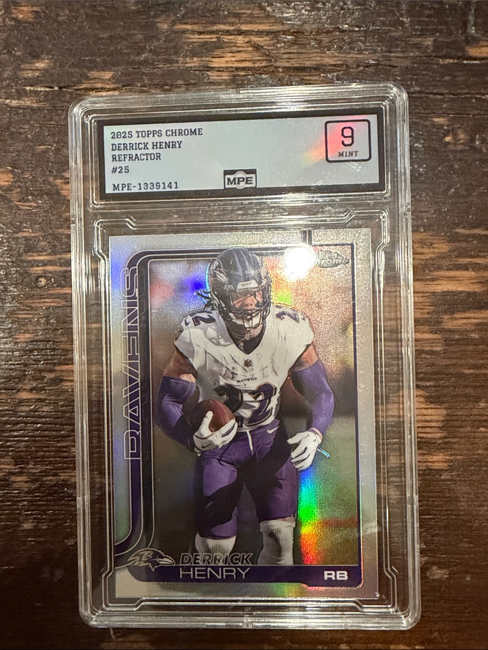 2025 Topps Chrome Derrick Henry Refractor Football Card  graded 9 mint.